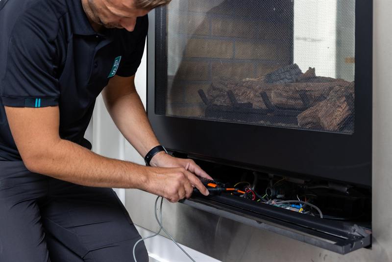Licensed gas fitter installing a cooktop