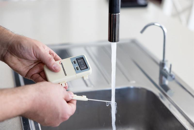 Plumber servicing a hot water system